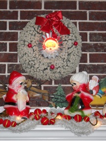Chalkware Santa and Mrs. Claus on mantel